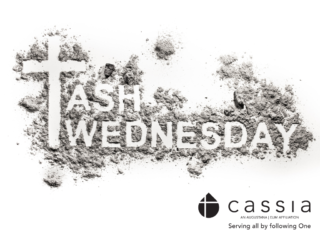 Cross with words Ash Wednesday drawn in ashes